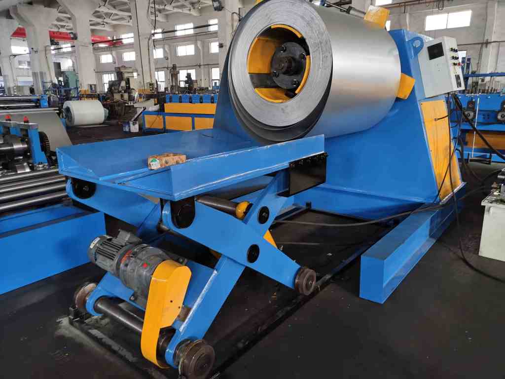 Hydraulic Decoiler Machine operating in a metal manufacturing facility.